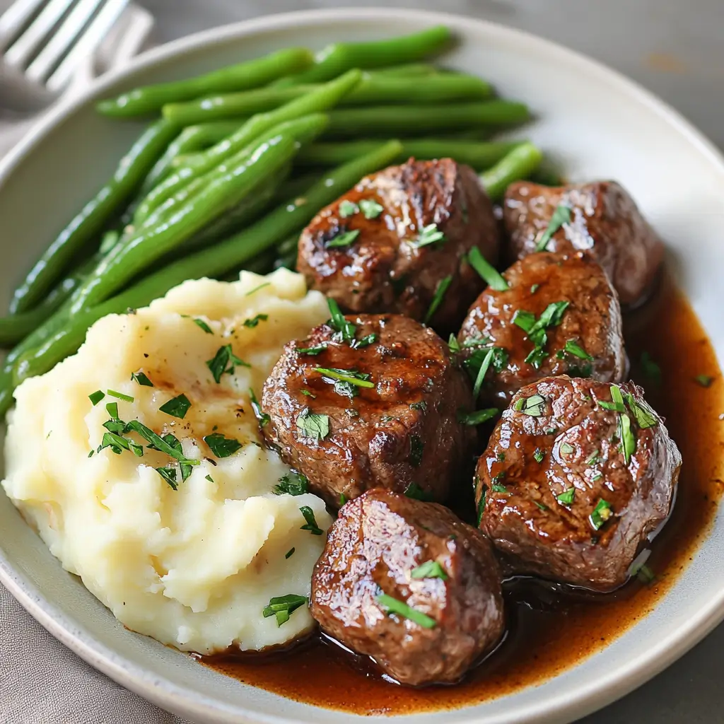 5-Ingredient Crockpot Steak Bites – Amazing Flavor in 5 Steps 13 Plated 5-Ingredient Crockpot Steak Bites with sides