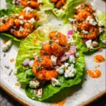 How to Make Irresistible Buffalo Shrimp Lettuce Wrap Tacos in Just 20 Minutes 7 Buffalo shrimp lettuce wrap tacos with ranch, red onion, and celery in crisp romaine