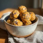 Pumpkin Pie Energy Balls – 5-Min No-Bake Snack You’ll Love 7 Pumpkin pie energy balls with oats, chia seeds, and chocolate chips in a ceramic bowl