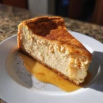 Pumpkin Protein Cheesecake – Stunning Guilt-Free Treat with 7 Simple Ingredients 7 Slice of pumpkin protein cheesecake with cinnamon and syrup on white plate