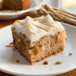 3-Ingredient Apple Cake: 1 Easy, Amazing Dessert Idea 7 Slice of 3-Ingredient Apple Cake with frosting and caramel drizzle on a white plate