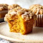 Pumpkin Streusel Muffins – Bakery-Style Fall Favorite in 30 Minutes 7 Pumpkin streusel muffins with cinnamon crumb topping on rustic table – pumpkin muffins, pumpkin crumb muffins