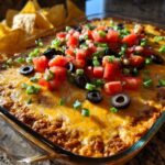 New Year Cheesy Taco Dip with Tri-Color Chips